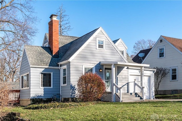 rear view of house featuring a yard