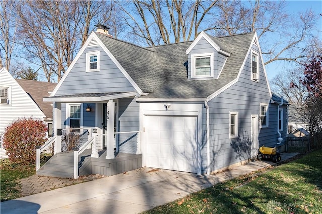 cape cod home with a garage