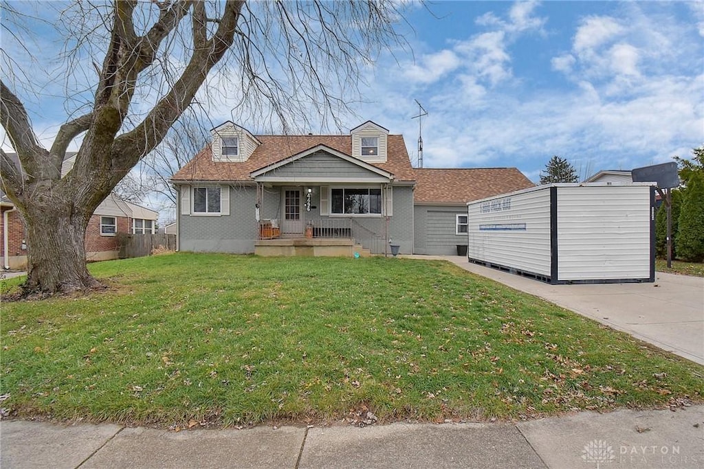 bungalow featuring a porch and a front yard