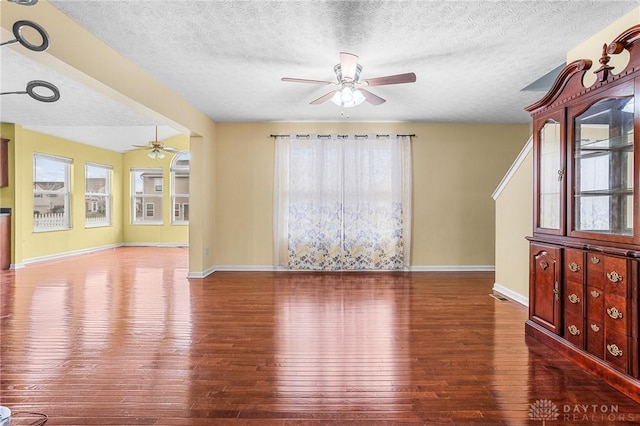 interior space with hardwood / wood-style floors and a textured ceiling