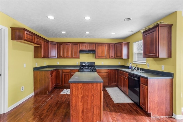 kitchen featuring sink, a center island, dark wood-type flooring, and black appliances