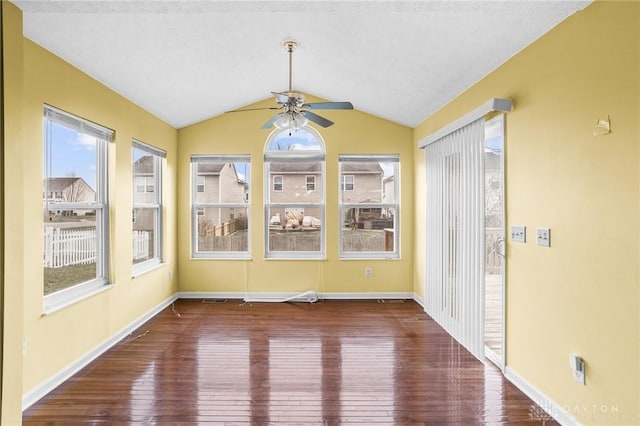 unfurnished sunroom featuring ceiling fan and lofted ceiling