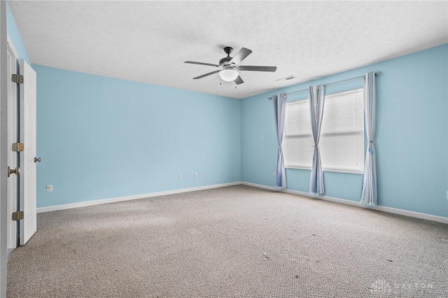 unfurnished room featuring carpet flooring, ceiling fan, and a textured ceiling