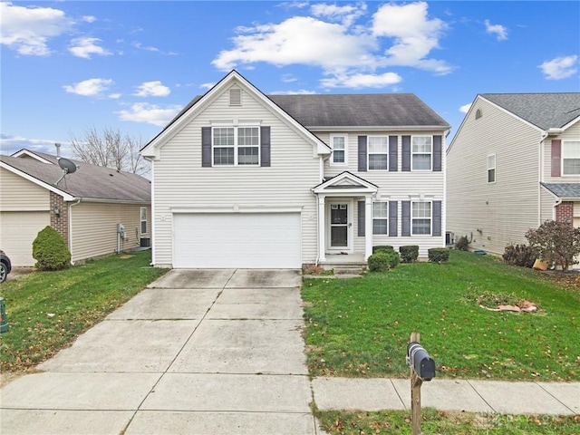 view of front of house with a garage and a front lawn