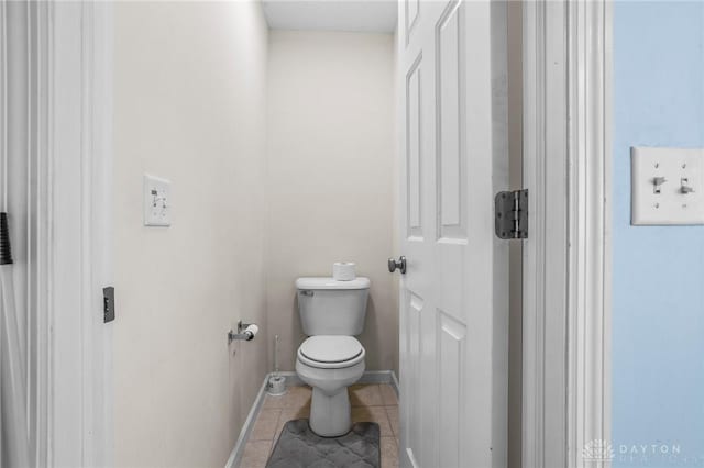 bathroom featuring tile patterned flooring and toilet