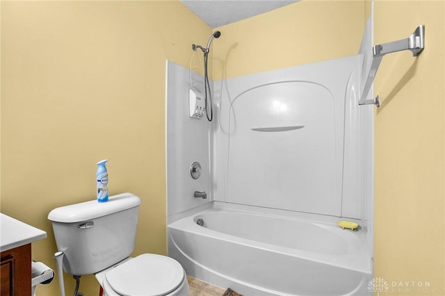 full bathroom with vanity, a textured ceiling, shower / bath combination, and toilet