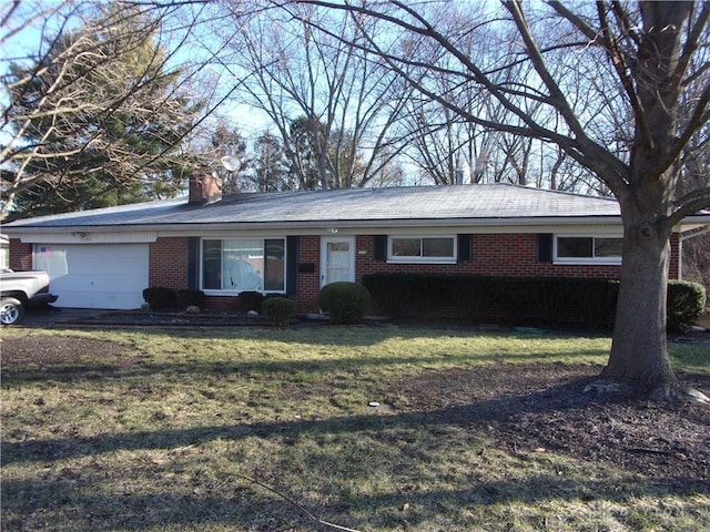 single story home with a garage and a front lawn