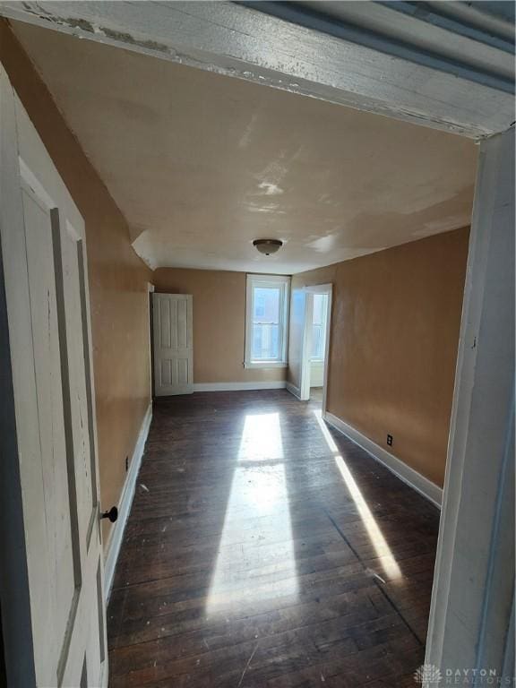 empty room featuring dark hardwood / wood-style floors