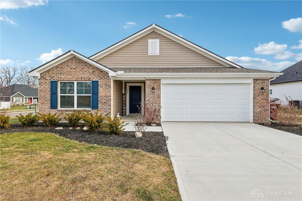 view of front of house with a front lawn and a garage