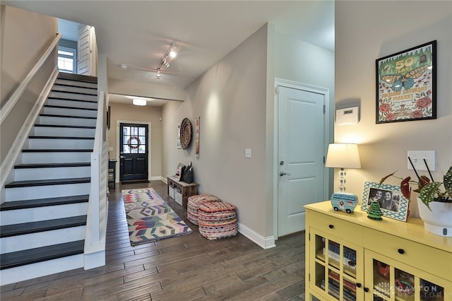 foyer featuring dark hardwood / wood-style flooring and rail lighting