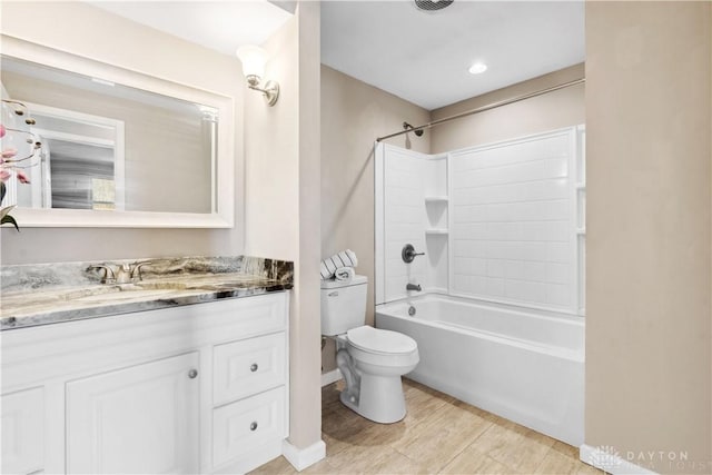 full bathroom with toilet, vanity, and tub / shower combination