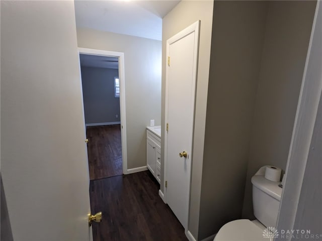 bathroom featuring hardwood / wood-style floors, vanity, and toilet