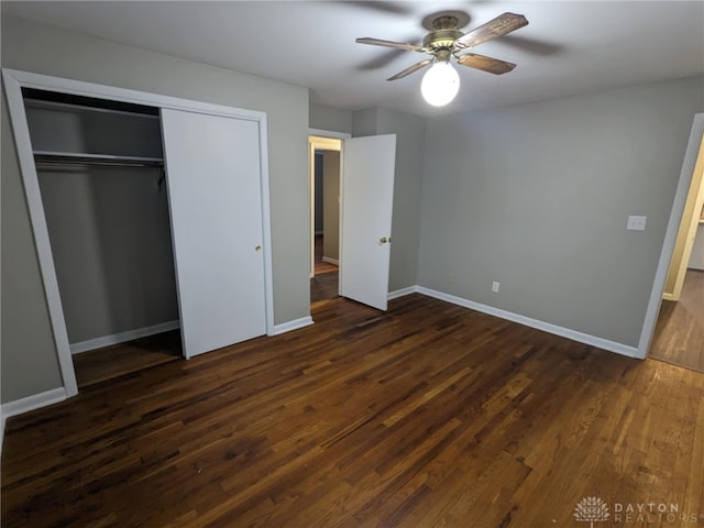 unfurnished bedroom with a closet, ceiling fan, and dark hardwood / wood-style flooring