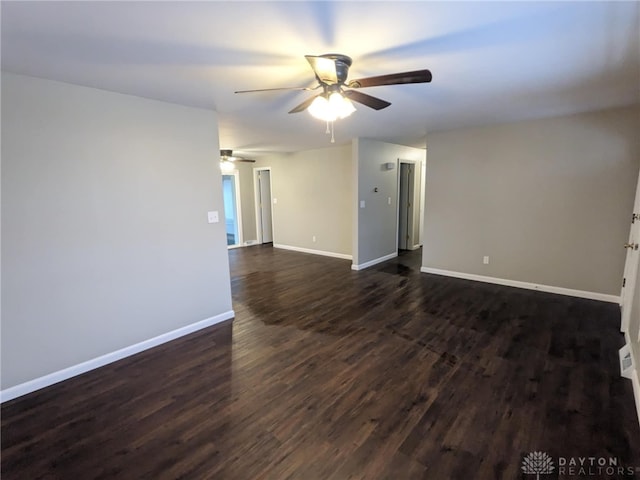 empty room featuring dark wood-type flooring