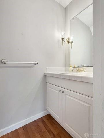 bathroom featuring wood-type flooring and vanity