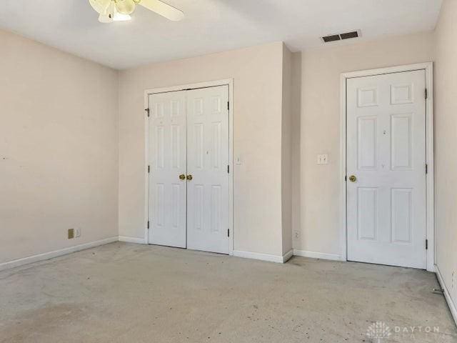 unfurnished bedroom with ceiling fan