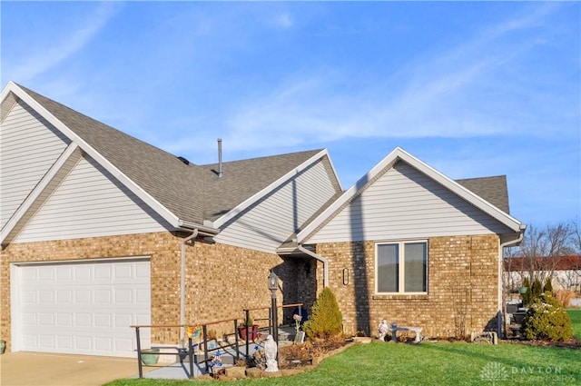 view of front facade with a front yard and a garage