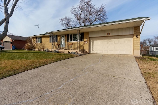 ranch-style house with a front lawn, a porch, and a garage