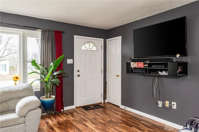 entryway with dark hardwood / wood-style floors