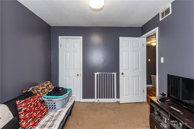 bedroom with light carpet