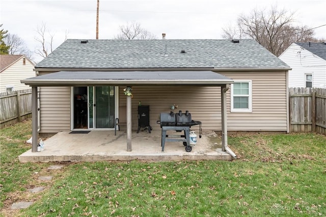 back of property featuring a patio and a lawn