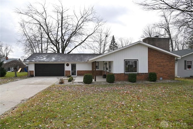 ranch-style house featuring a garage and a front yard