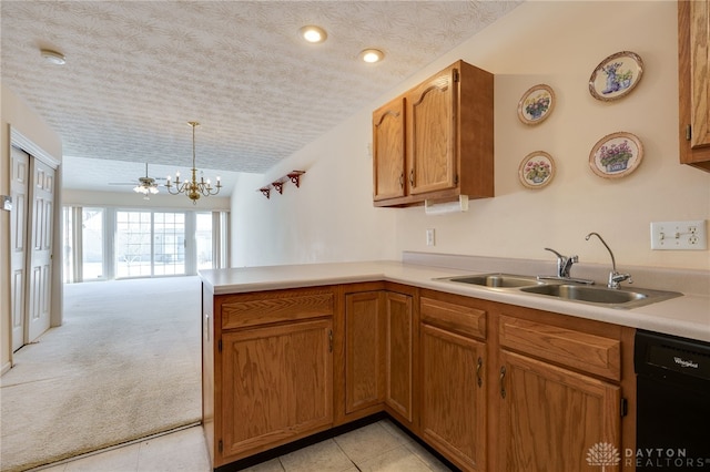 kitchen featuring sink, decorative light fixtures, black dishwasher, light carpet, and kitchen peninsula