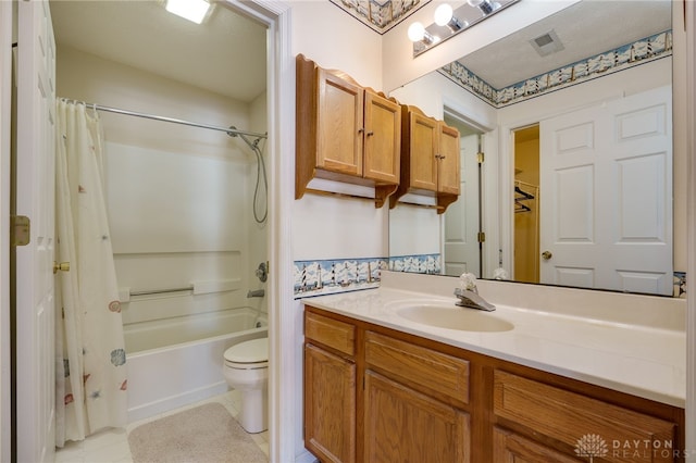 full bathroom featuring toilet, vanity, tile patterned flooring, and shower / bath combo with shower curtain