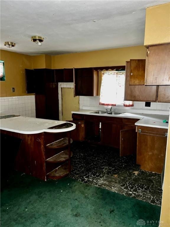 kitchen featuring decorative backsplash and sink