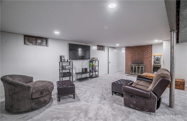 living room with light carpet and a brick fireplace