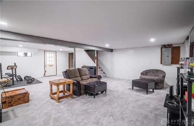 carpeted living room featuring electric panel