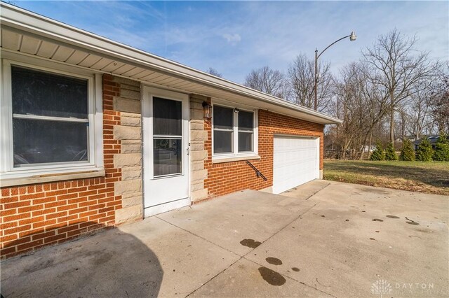 view of exterior entry featuring a garage