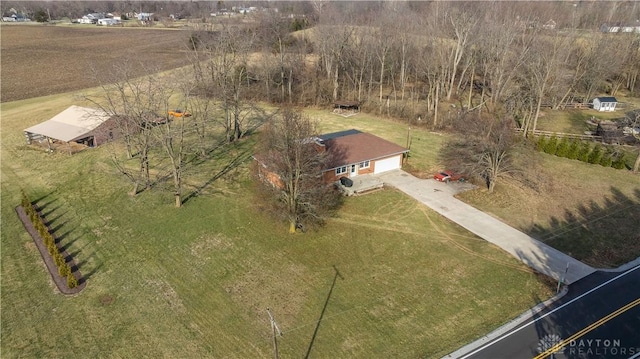 birds eye view of property with a rural view