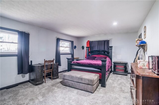 bedroom with light colored carpet