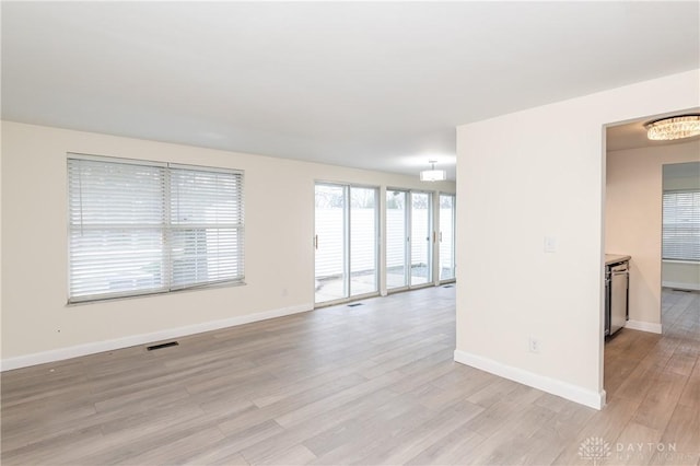 empty room with light wood-type flooring