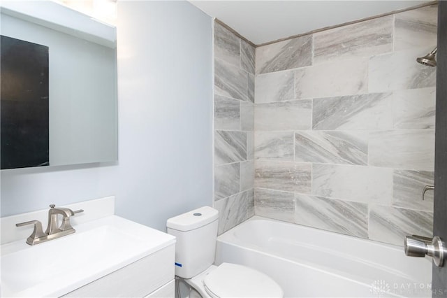 full bathroom with vanity, toilet, and tiled shower / bath