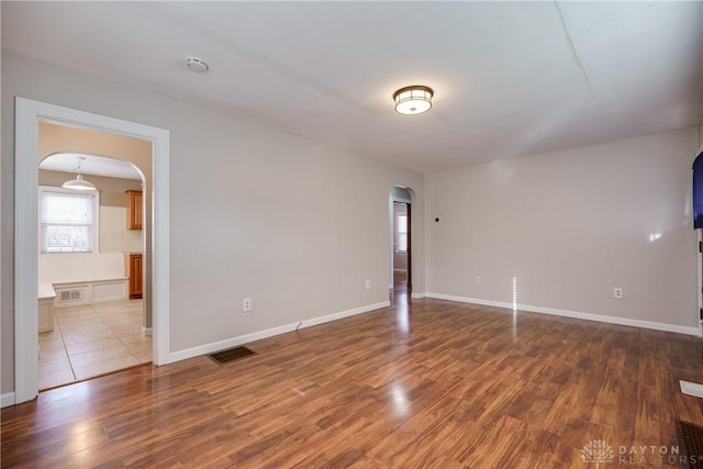 spare room featuring hardwood / wood-style flooring