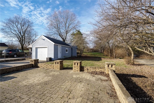 view of home's exterior featuring an outbuilding and a garage