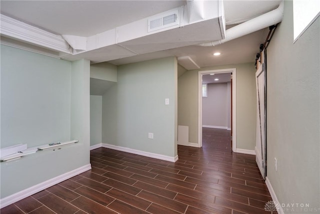 basement featuring a barn door