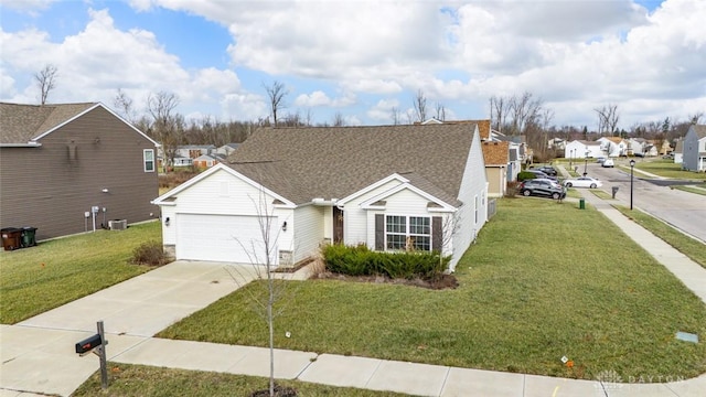 view of front of house with a front yard, a garage, and central AC unit