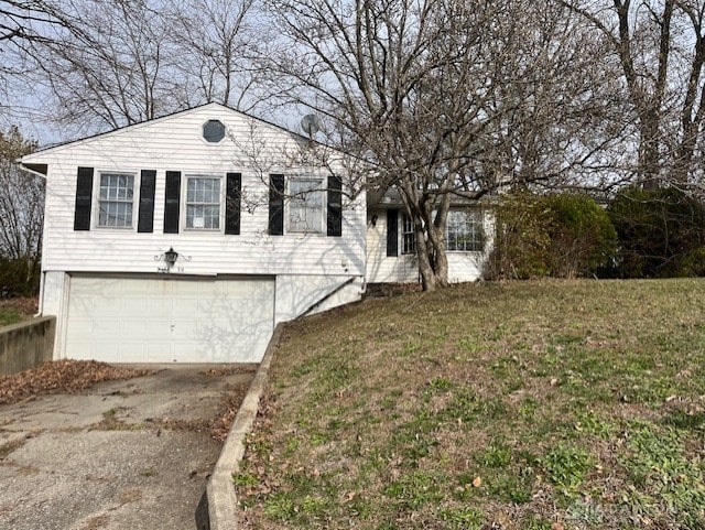 view of front of house with a front lawn and a garage