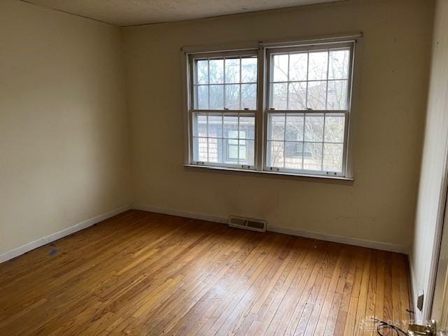 unfurnished room featuring light hardwood / wood-style flooring