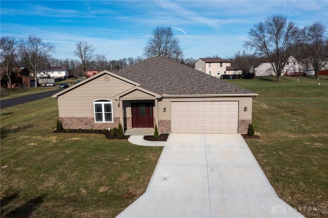 single story home featuring a garage and a front lawn