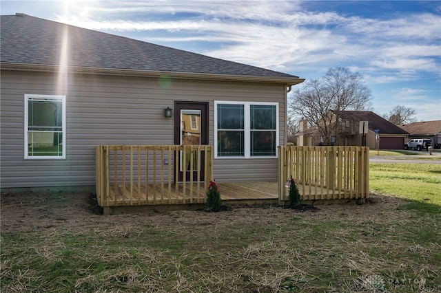 rear view of property with a lawn