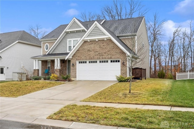 craftsman-style house featuring a front lawn and a garage