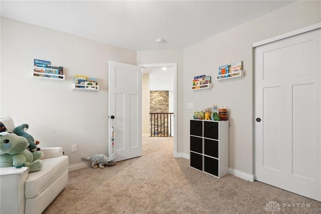 living area featuring light colored carpet