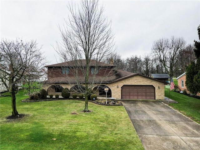 view of front of home featuring a front lawn and a garage