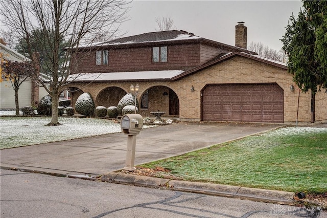 view of front of property with a garage