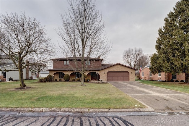 view of front of property with a garage and a front yard