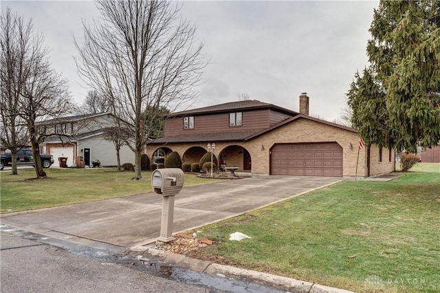 view of front of property with a garage and a front lawn